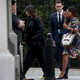 Kim Kardashian (center) enters the White House grounds on May 30, 2018, in Washington, D.C.